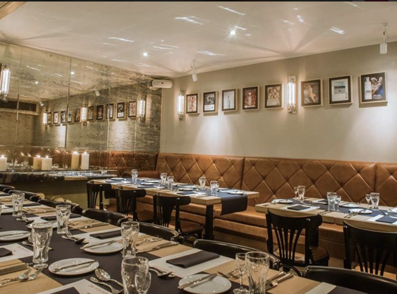 Private dining room with tiered seating for corporate dinners and networking events.