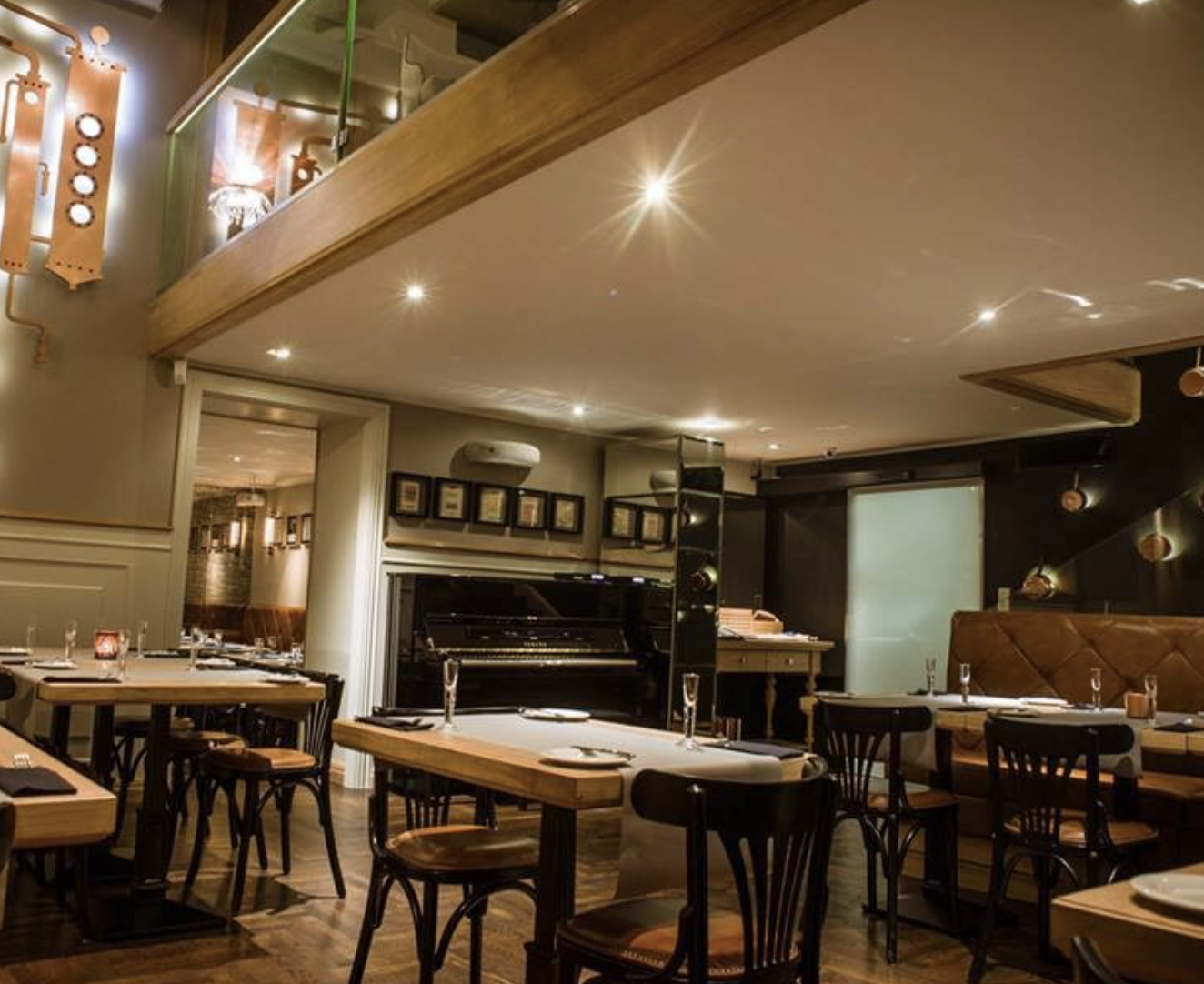 Elixir Restaurant: Private dinner venue with piano for upscale networking events.