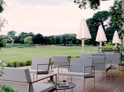 The Masters Suite at The Belfry: stylish outdoor meeting space with lush greenery.