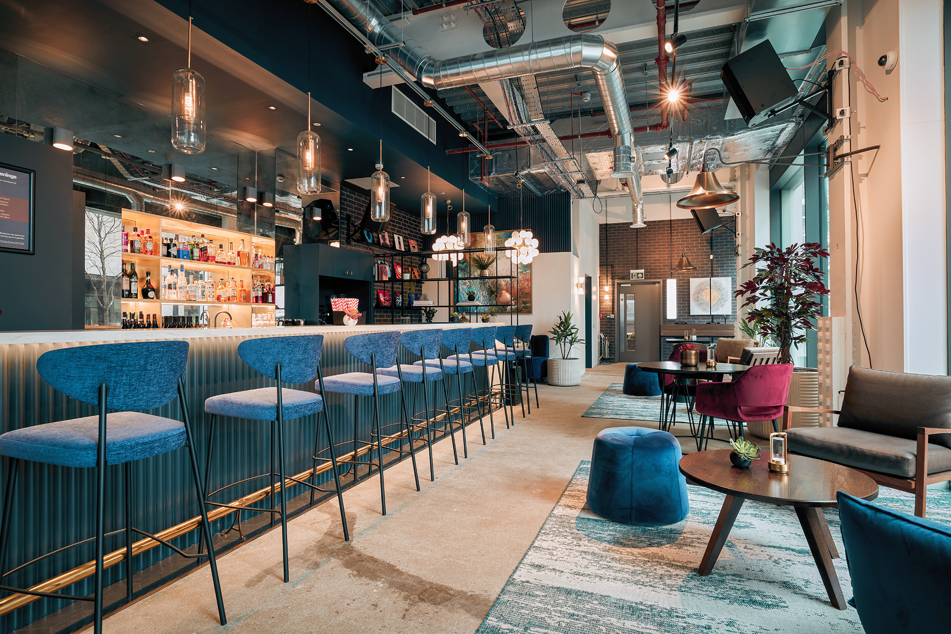 Modern Table Top Podcast Room in Qube, perfect for networking and social gatherings.