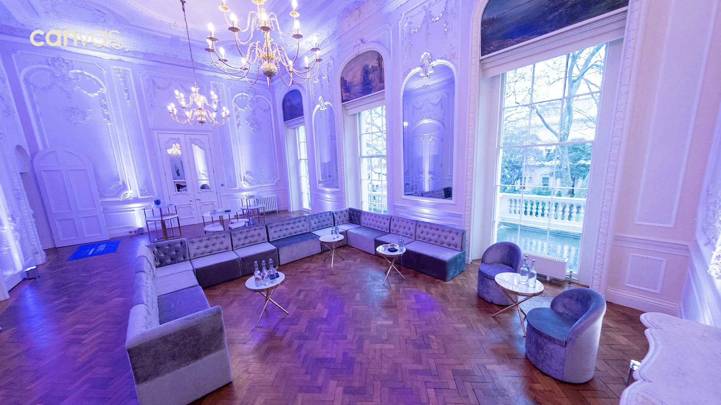 Corporate networking lounge at Carlton Terrace featuring mood lighting and modular seating.