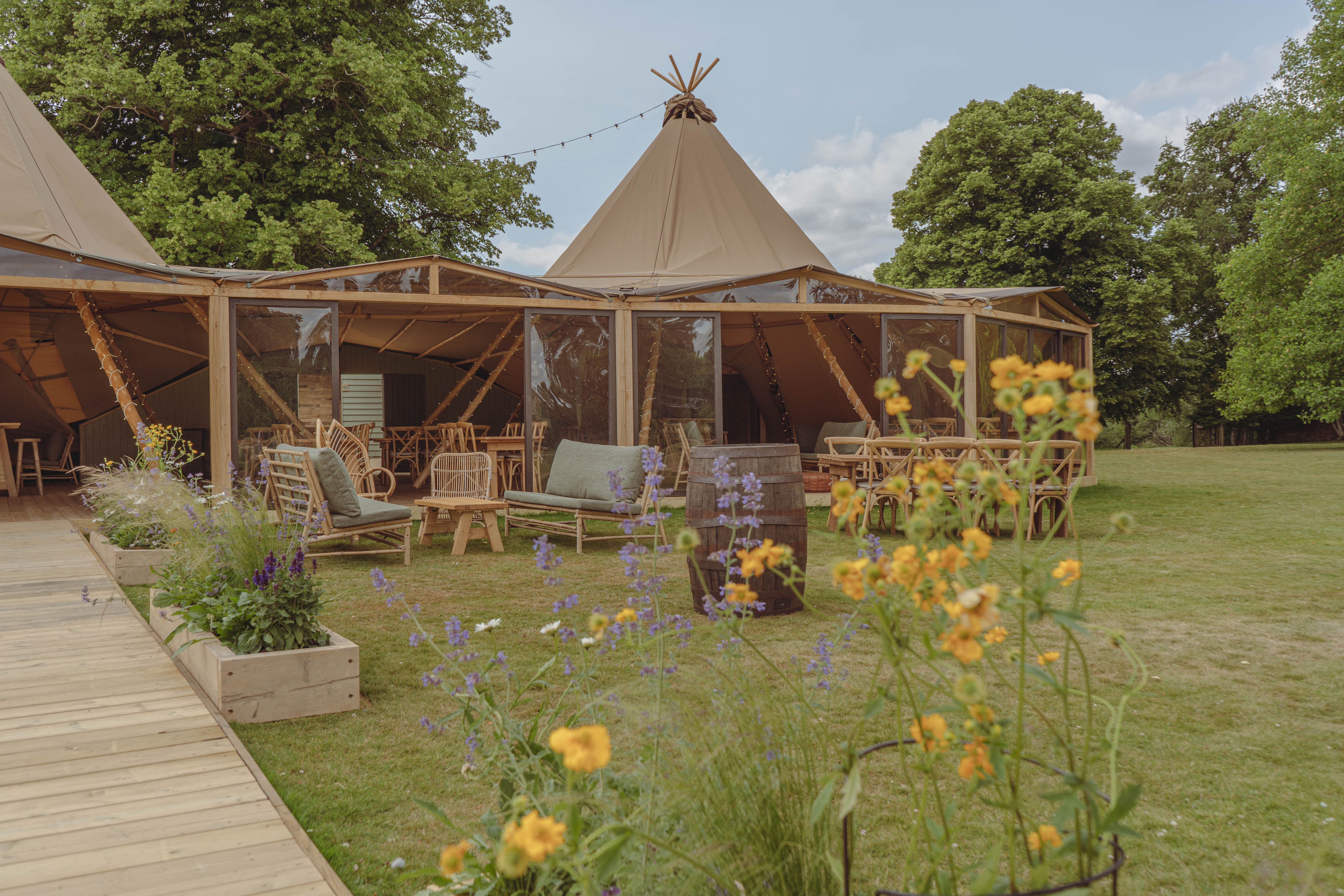Interconnected tipi venue at Mapledurham for rustic outdoor events and corporate retreats.