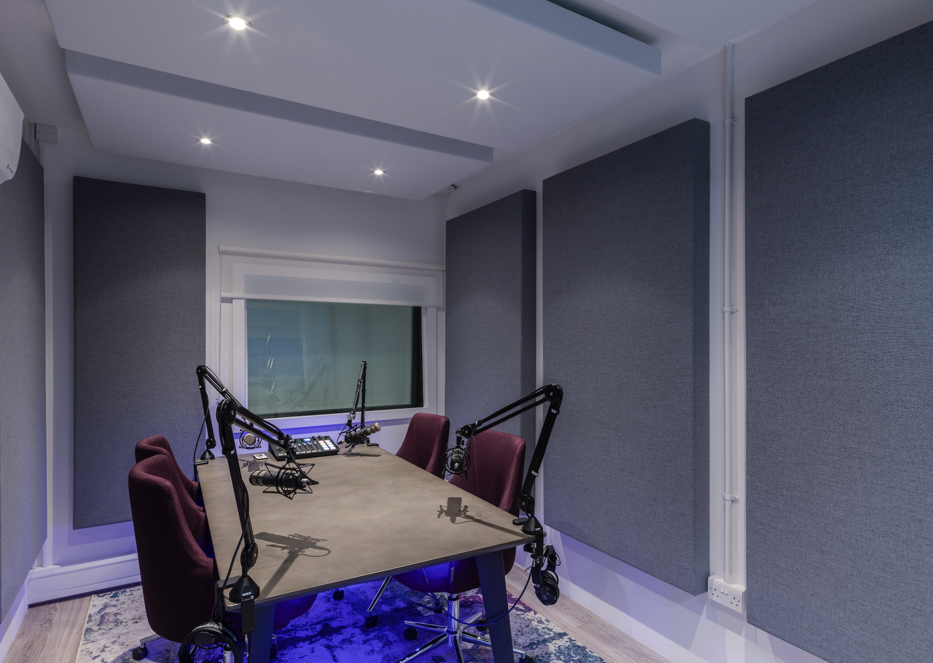 Soundproof meeting room in Qube West London for podcasts and virtual events.