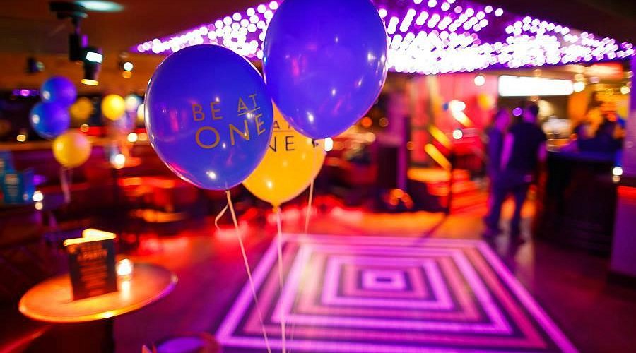 Birthday party at Be At One Russell St with vibrant LED dance floor lighting for social events.