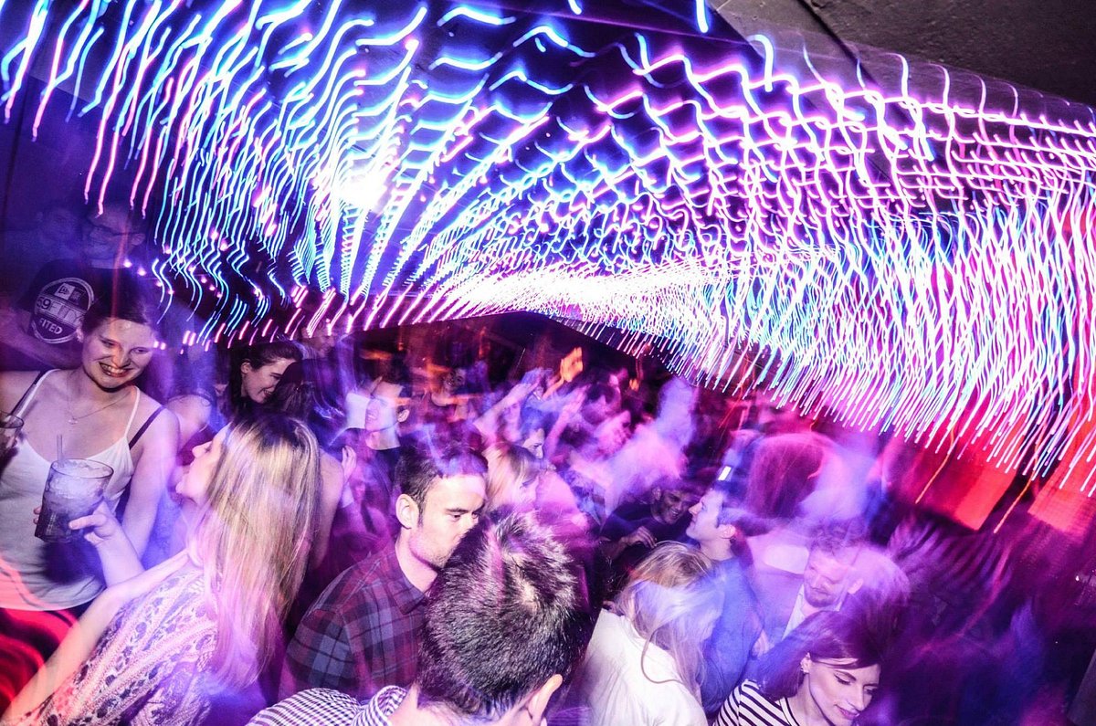 Vibrant LED-lit lounge at Be At One Russell St for birthday parties and networking events.