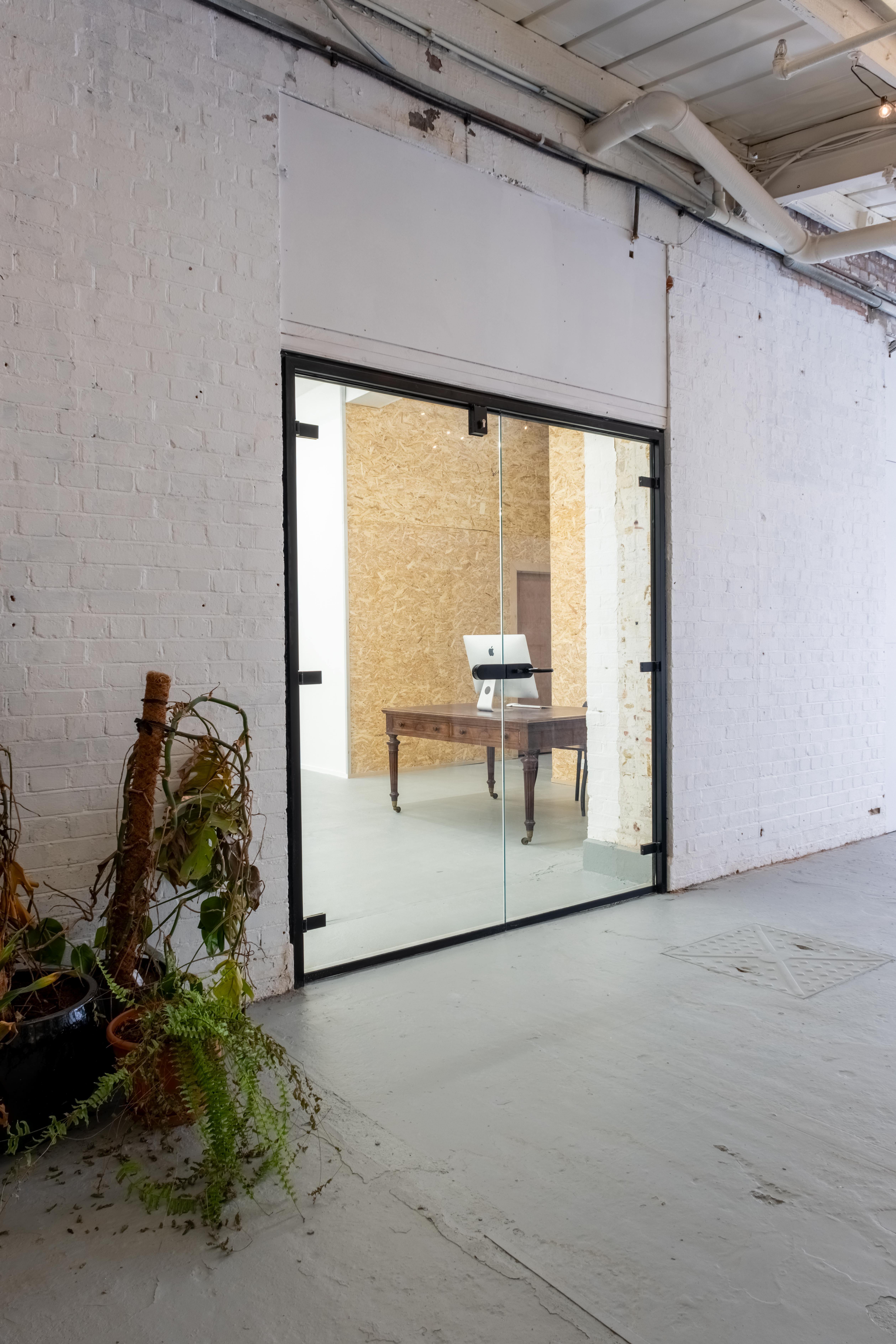 Industrial-chic breakout room at Orsman Road Studios for VIP planning and private consultations.