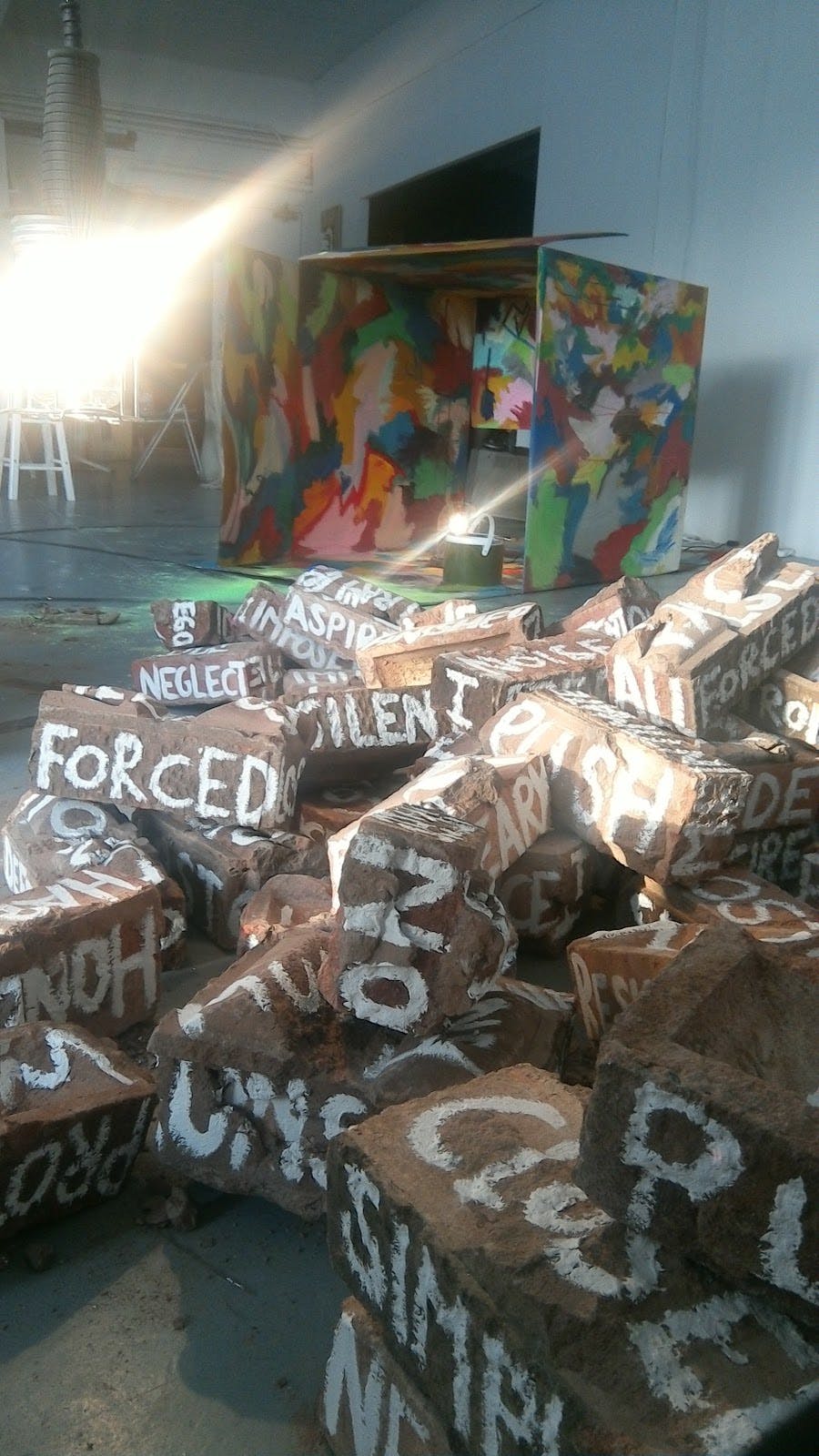 Art gallery installation featuring a loose brick pile, ideal for experiential events and activations.