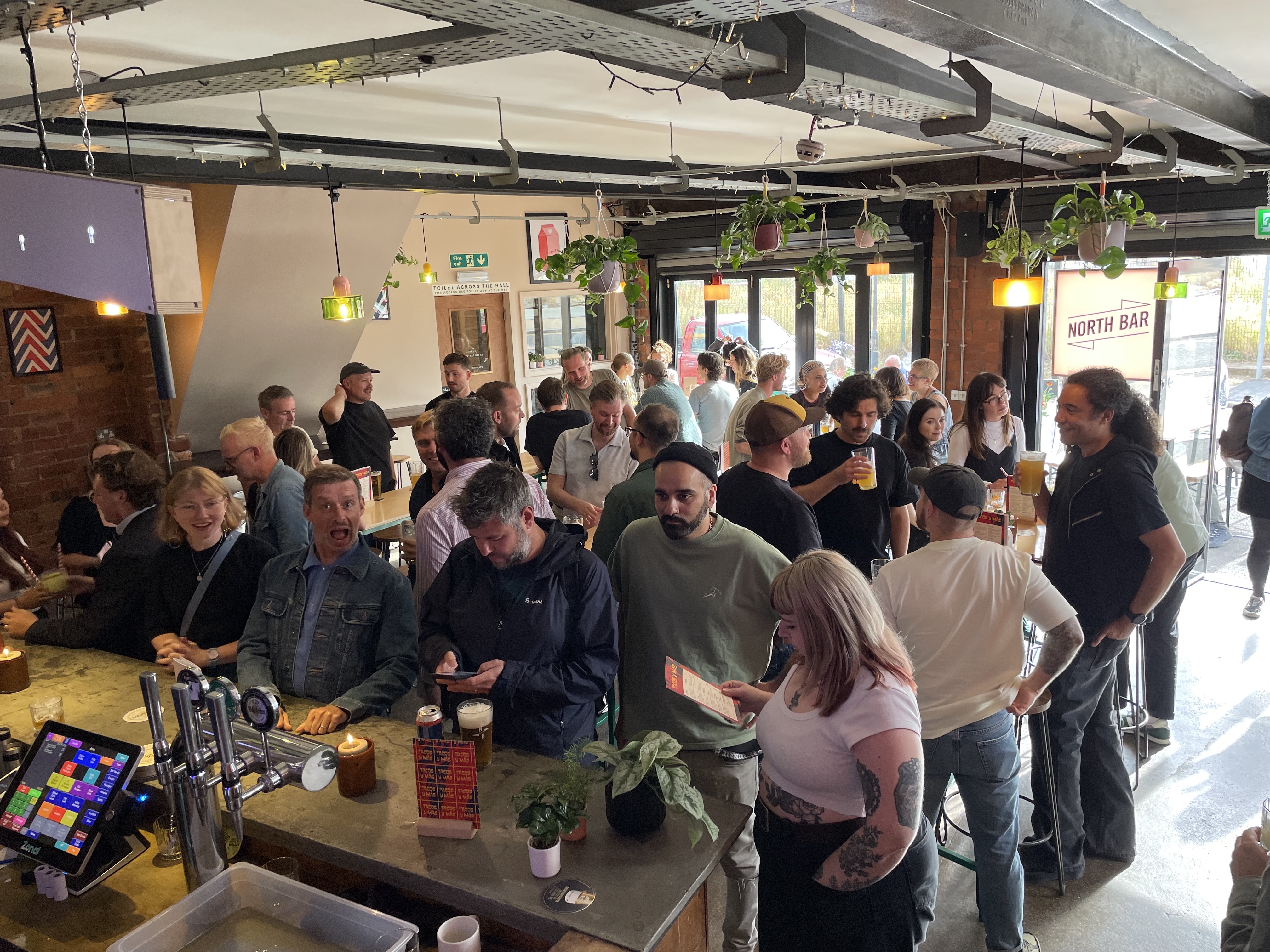 Industrial-chic North Bar Aire Park networking mixer, open floor social event.