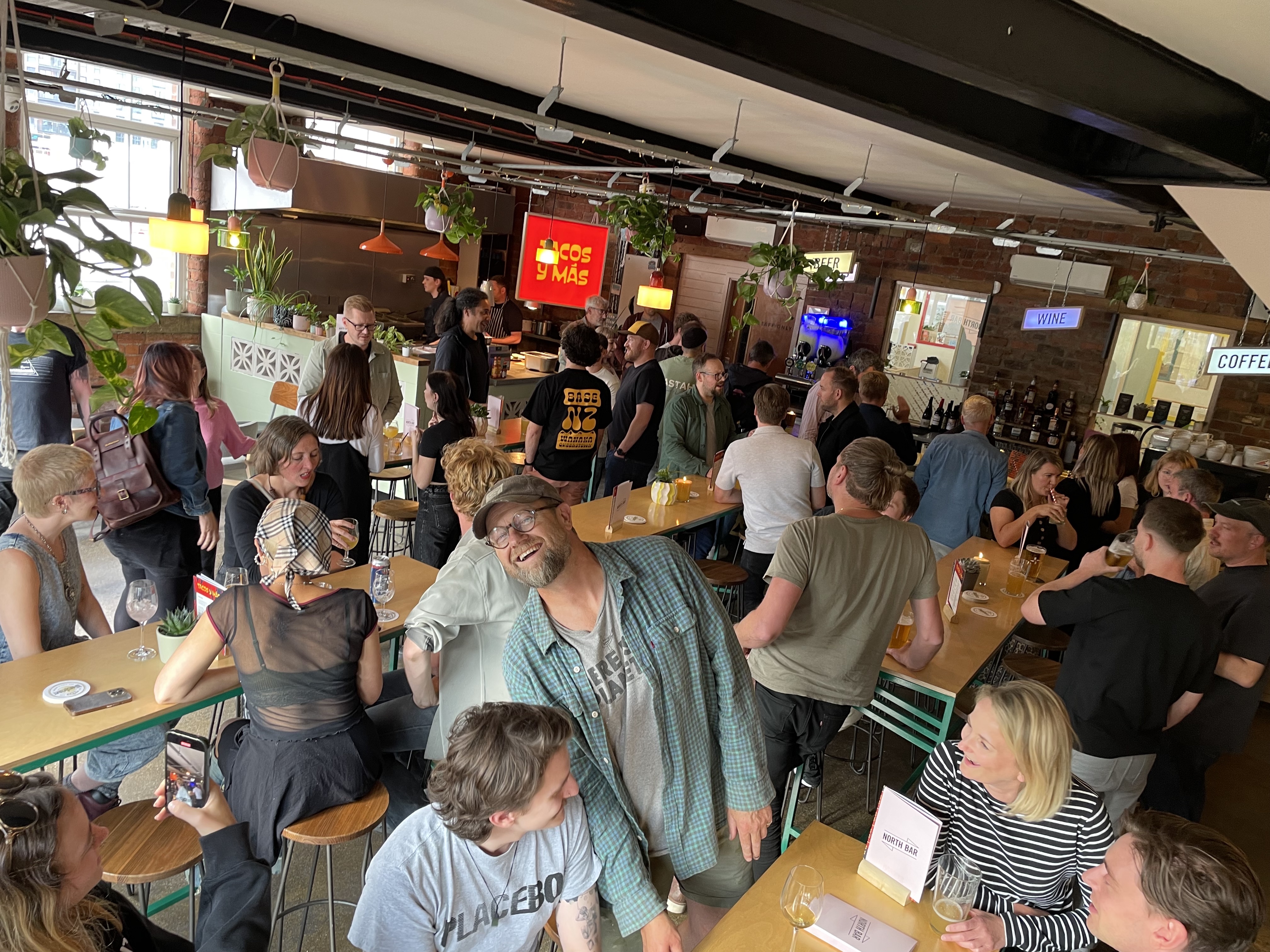 Industrial venue hosting a social mixer, perfect for networking events and corporate happy hours.