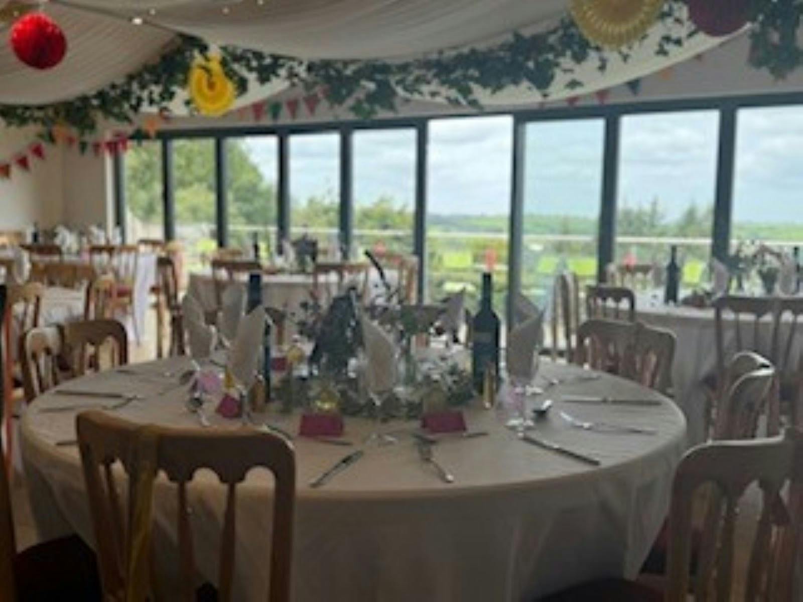 Function room at Bracken Tor House with banquet seating for rustic weddings and intimate receptions.