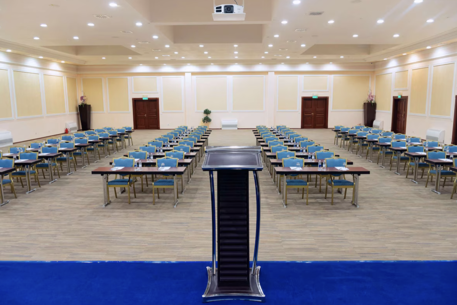 Theatre meeting room at Radisson Hotel Astana, schoolroom setup for corporate training events.