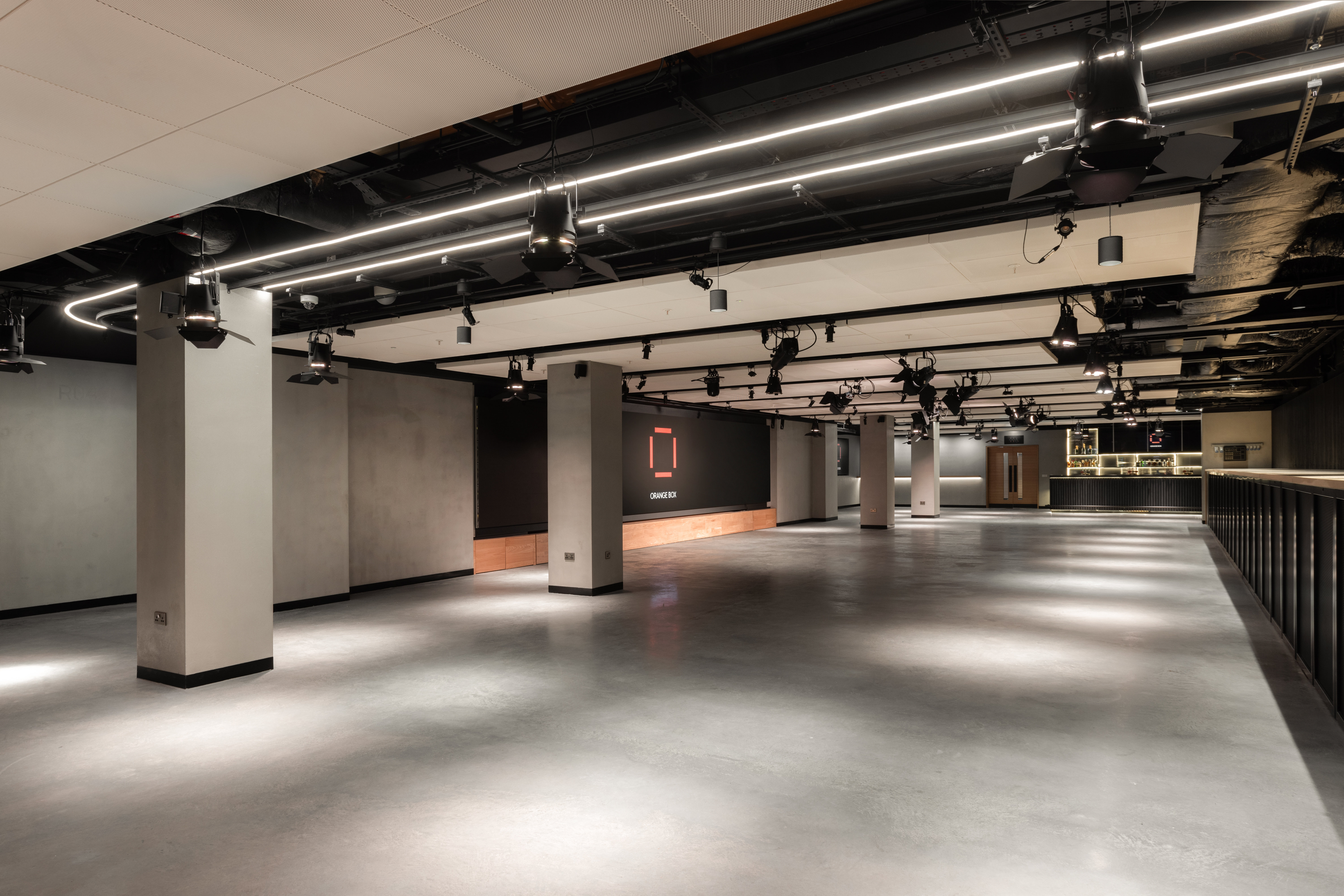 Versatile Orange Box venue in Fulham Pier with polished concrete flooring for events.