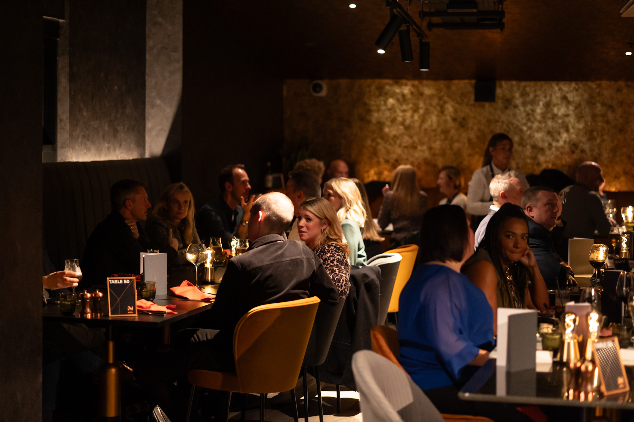 Lively restaurant The Mezz in AO Arena, perfect for networking and dinner parties.