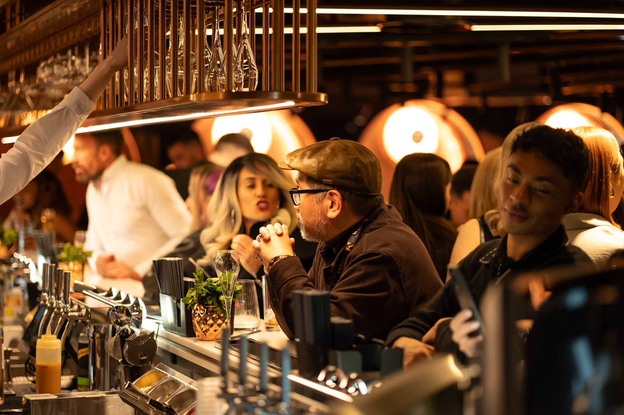 Lively bar at The Mezz, AO Arena, ideal for networking events and casual gatherings.