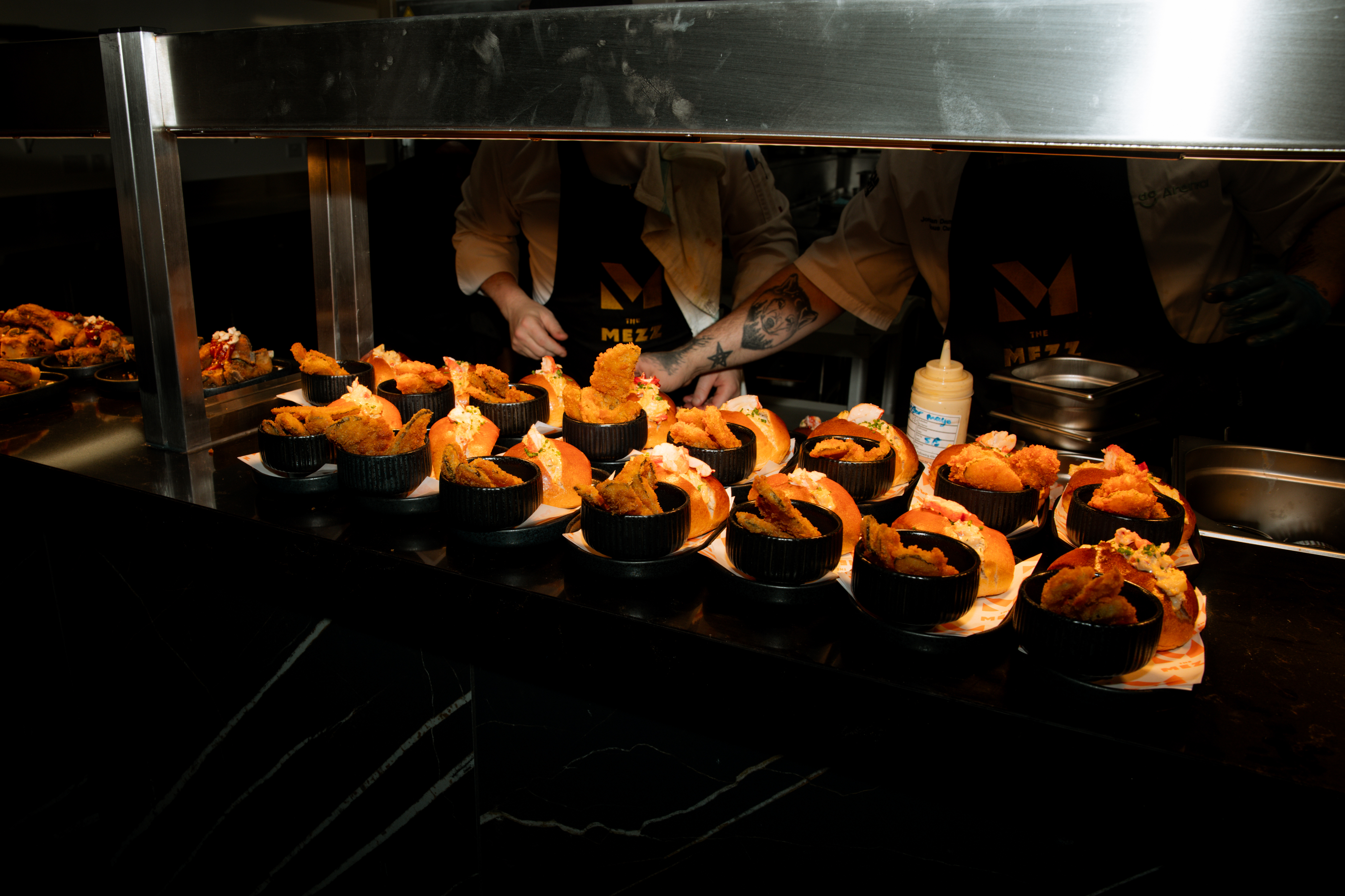Gourmet fried chicken display at The Mezz, AO Arena for upscale event catering.