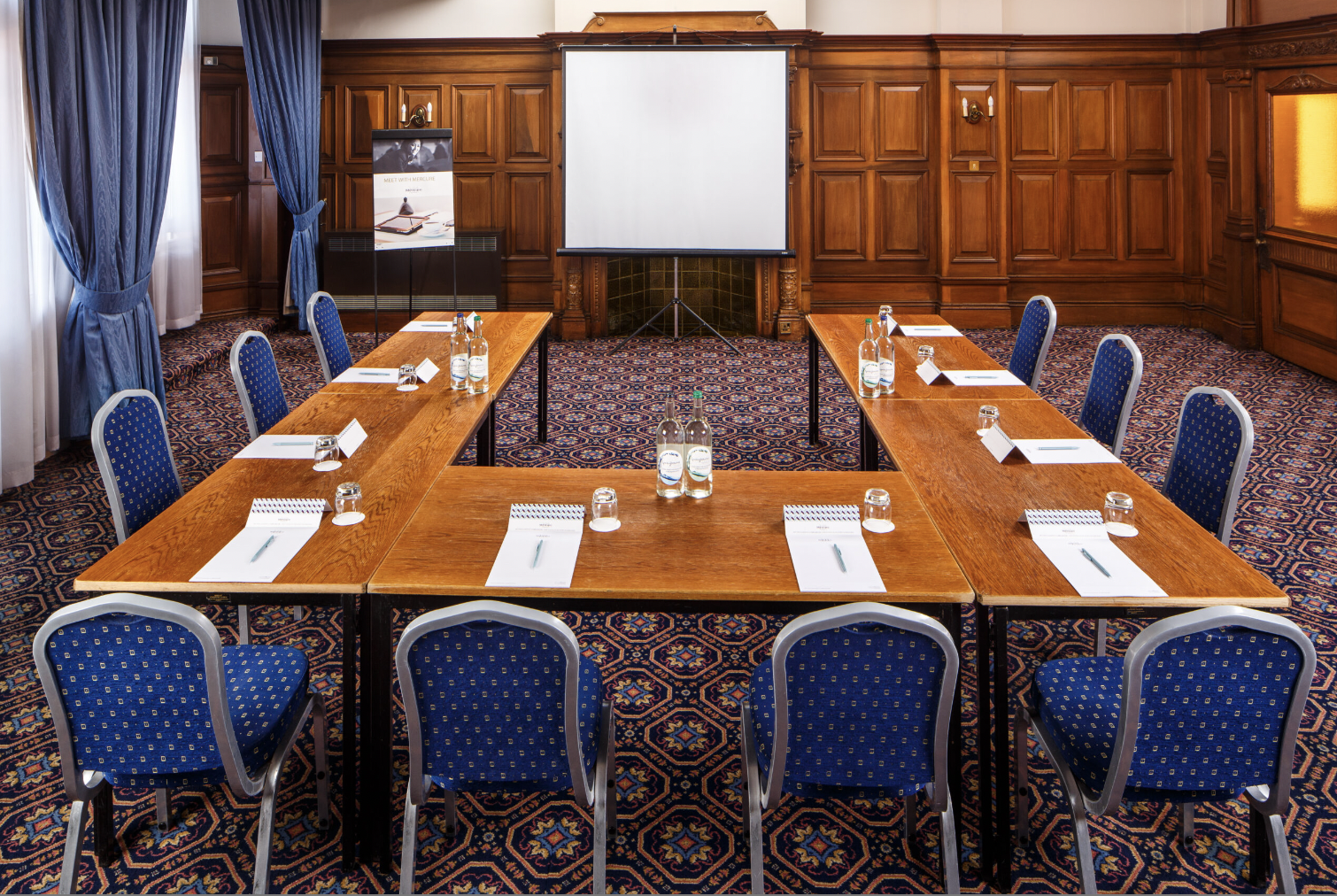 U-shape boardroom in wood-paneled Alexandra Room, ideal for corporate meetings and workshops.