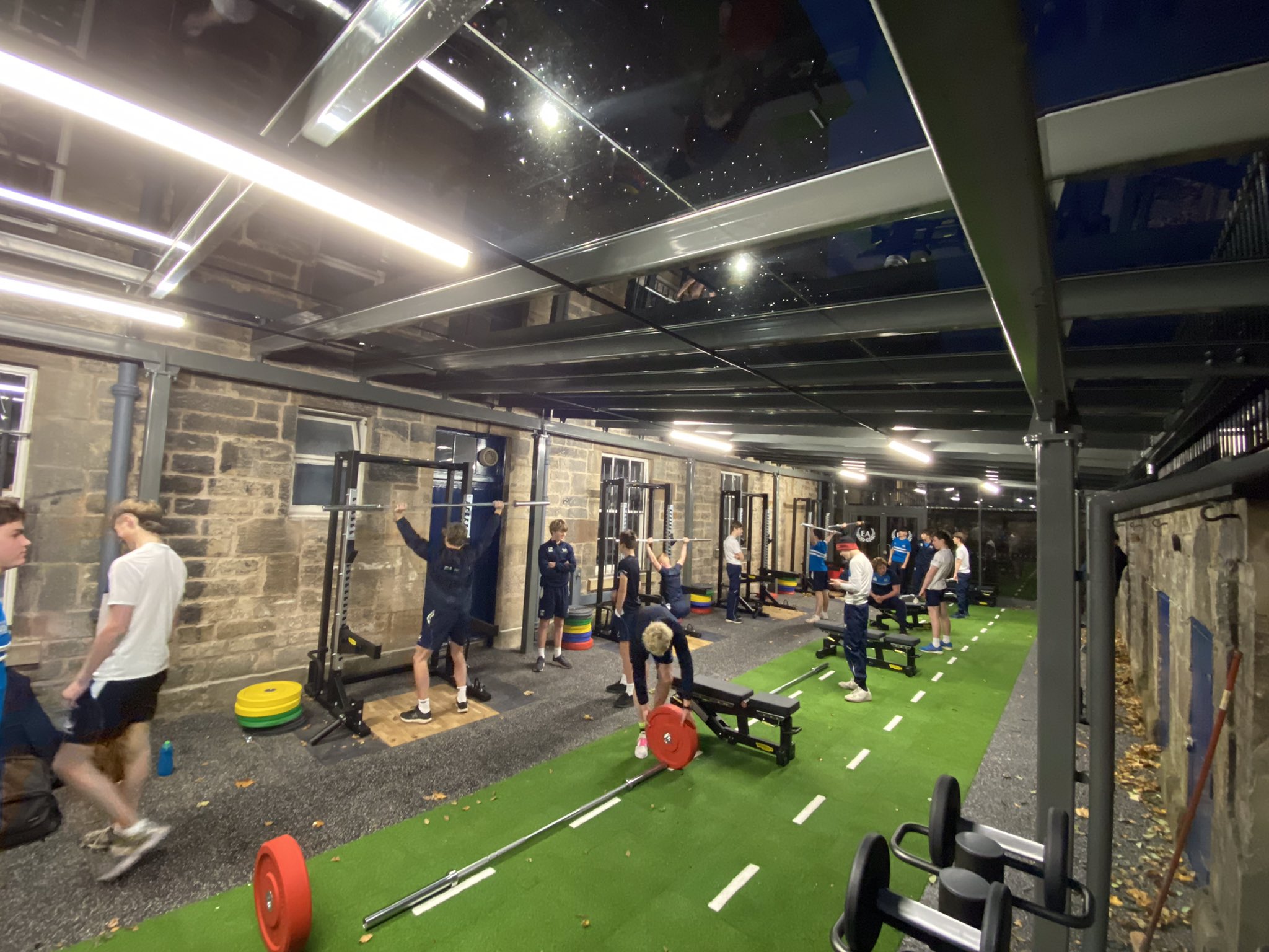 Industrial-chic Sports Hub gym for team-building workshops and wellness retreats.