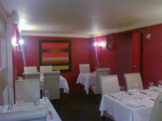 Wedgwood Restaurant private dining room with red walls for corporate events and board dinners.