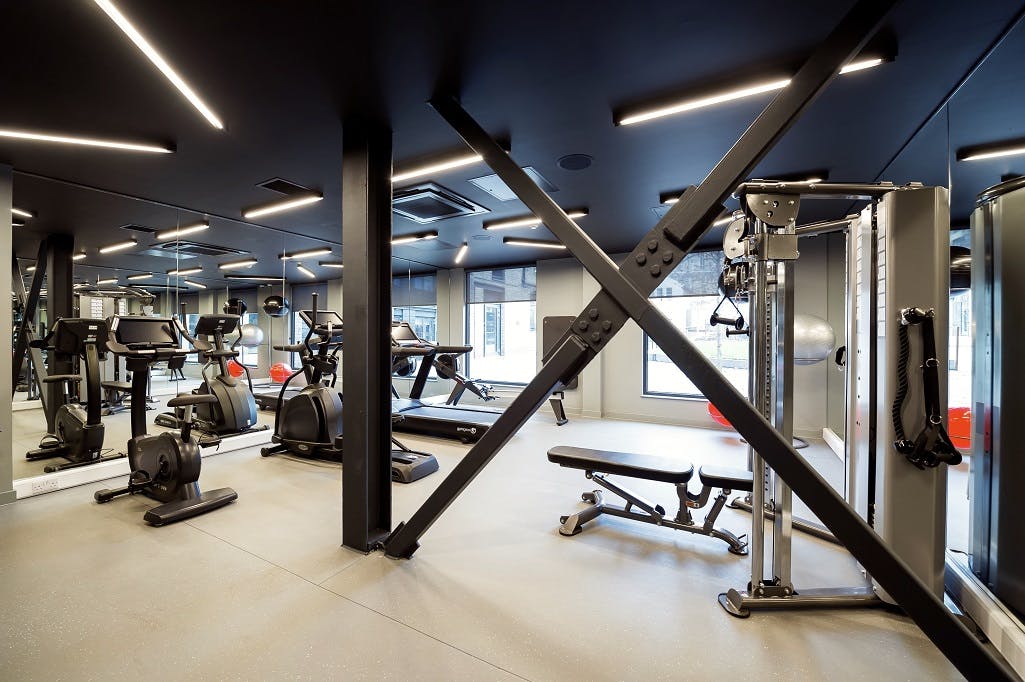 Modern fitness center in Wilde Aparthotels Edinburgh, ideal for event wellness and venue amenities.
