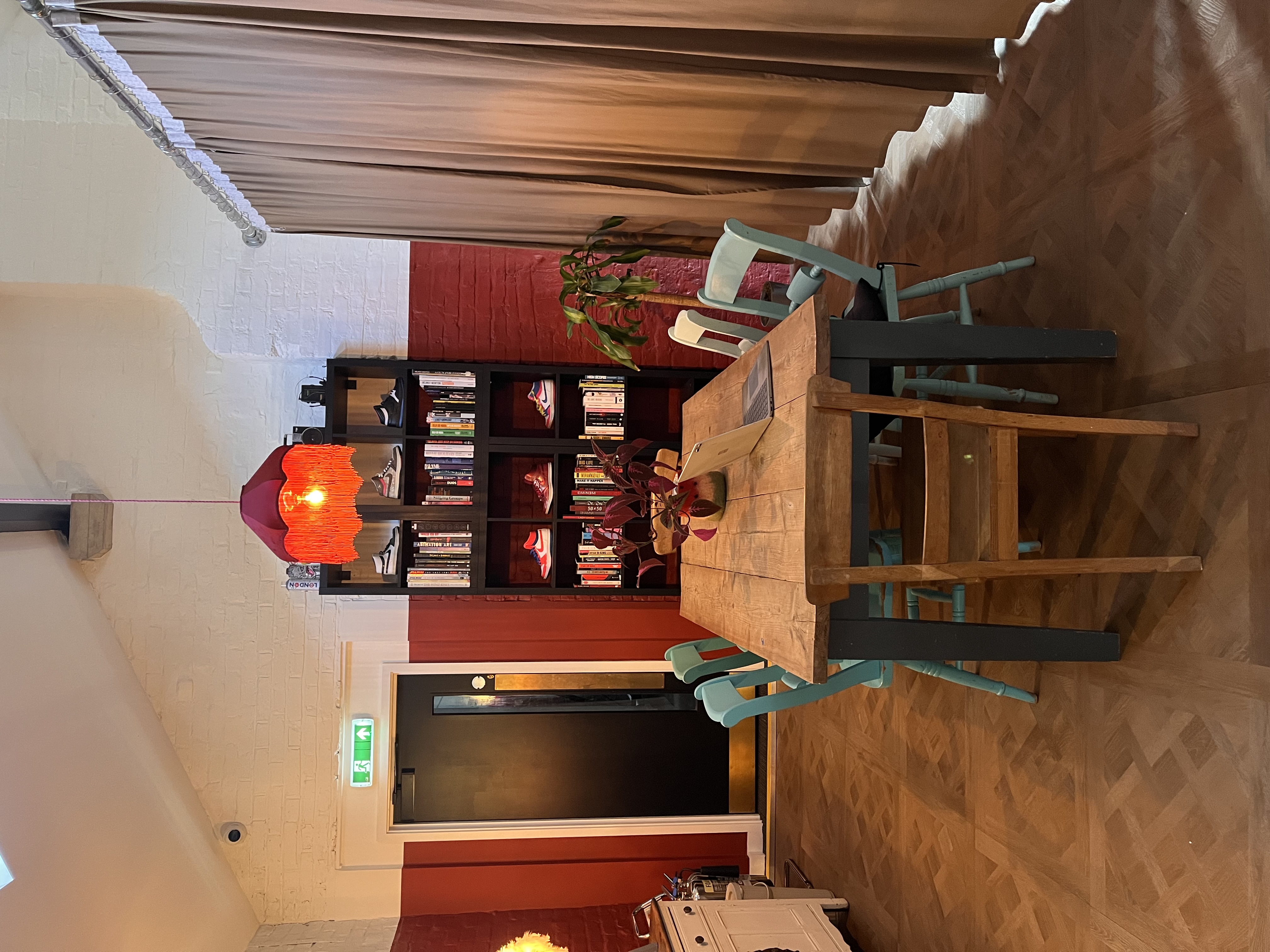Casual breakout room with eclectic seating for creative workshops and informal team meetings.