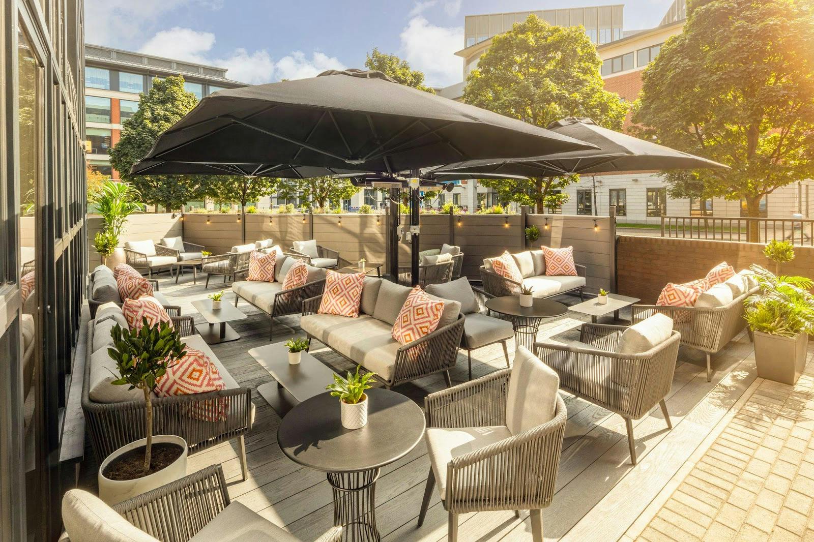 Outdoor breakout space with modular lounge seating at Crowne Plaza Leeds for corporate networking.