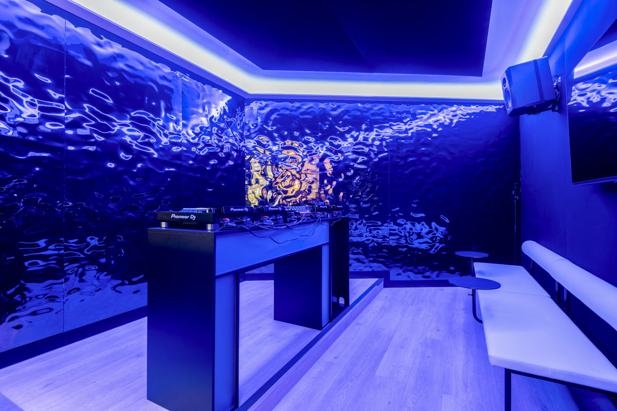 Modern event space in SE London with ambient blue lighting for parties and presentations.