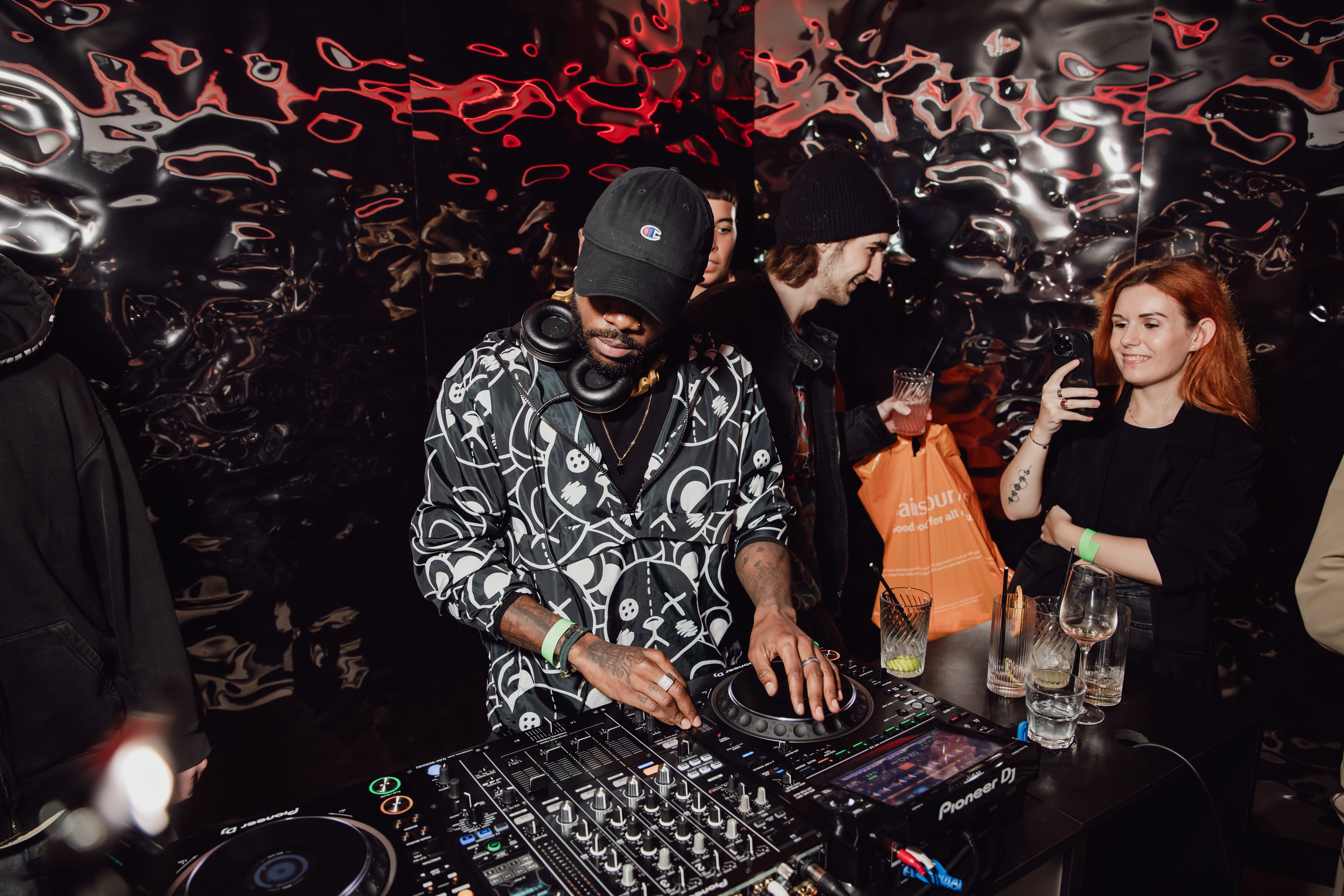 DJ at Qube Elephant Lounge & Bar creating a lively event atmosphere with vibrant music.