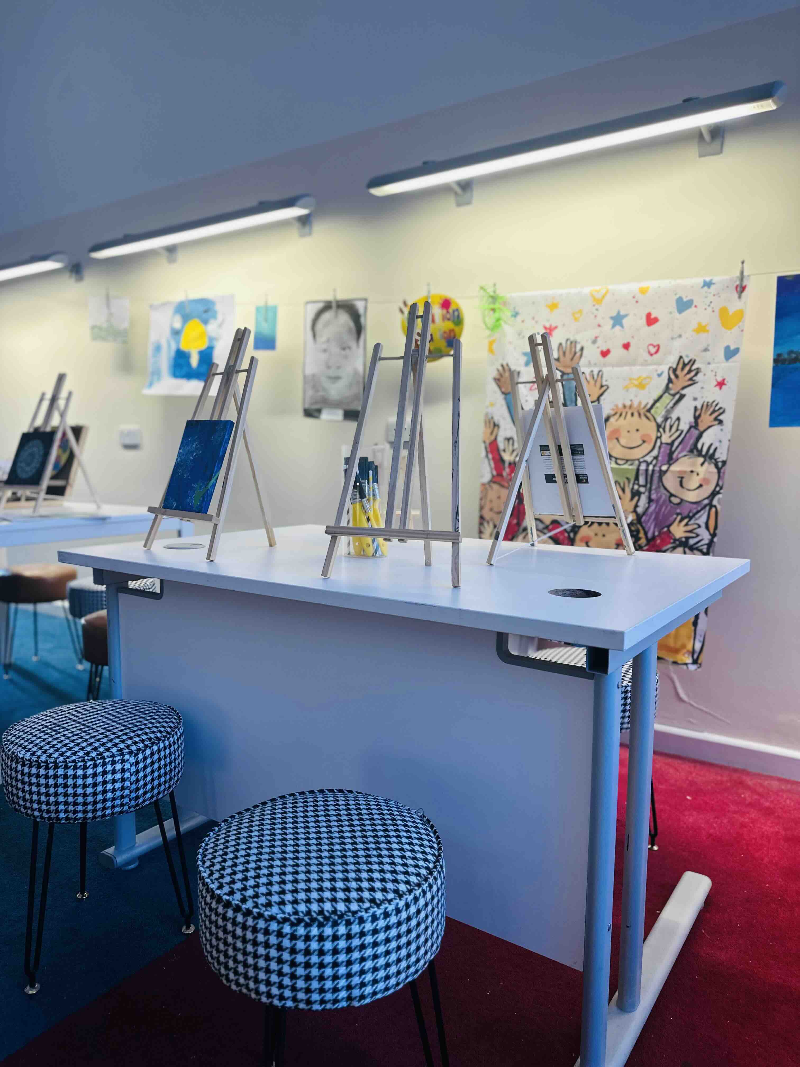 Artblast Studio creative workshop setup with easels for interactive team building events.