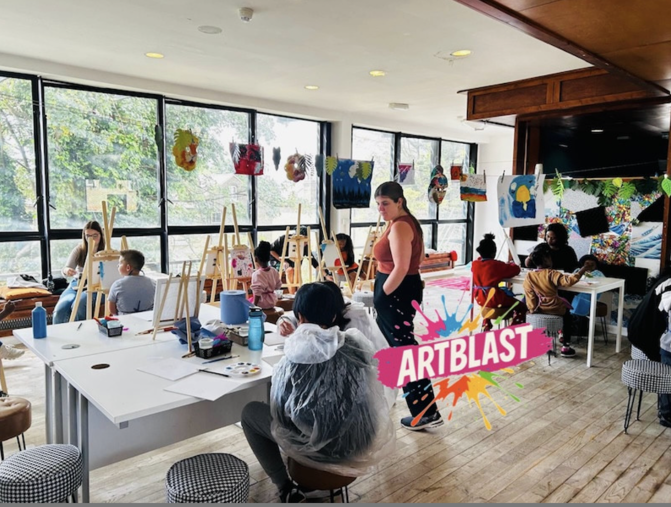 Artblast Kingston studio: Creative workshop space with modular tables for art classes.