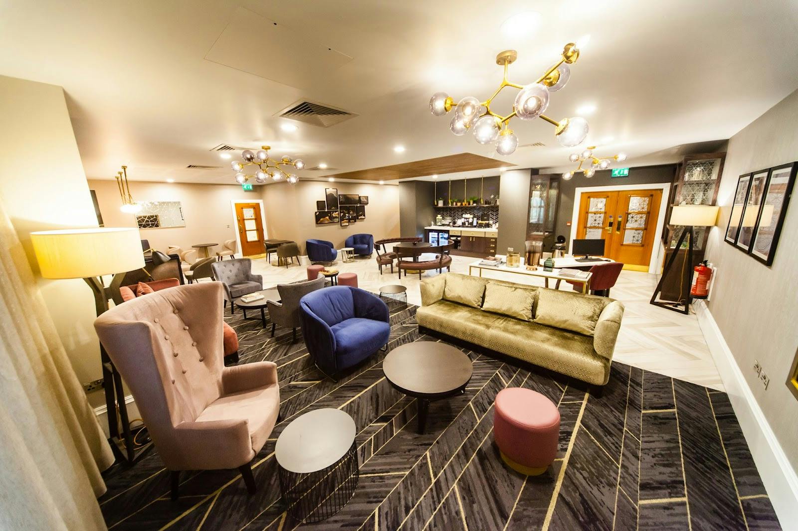Crowne Plaza breakout space with residential furniture for networking and VIP events.