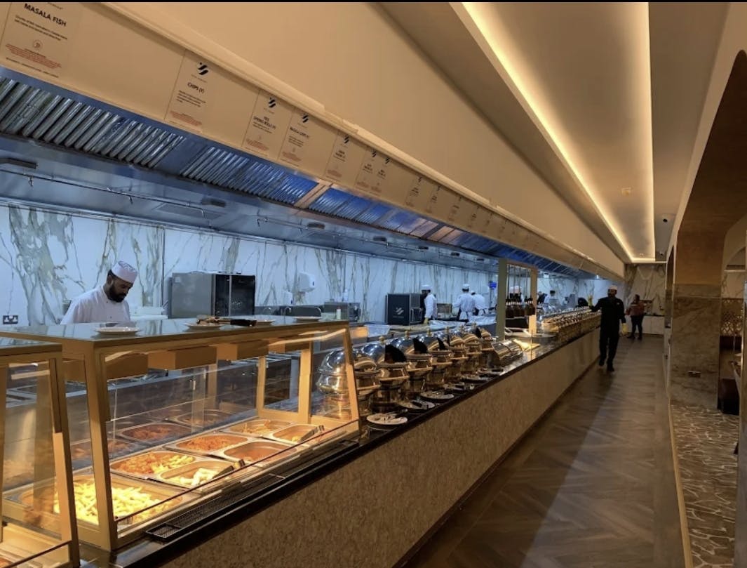 Royal Nawaab Pyramid banquet hall buffet line for large-scale conference catering.