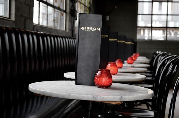 Intimate Gibson Street Bar reception with warm table lighting for corporate or private events.