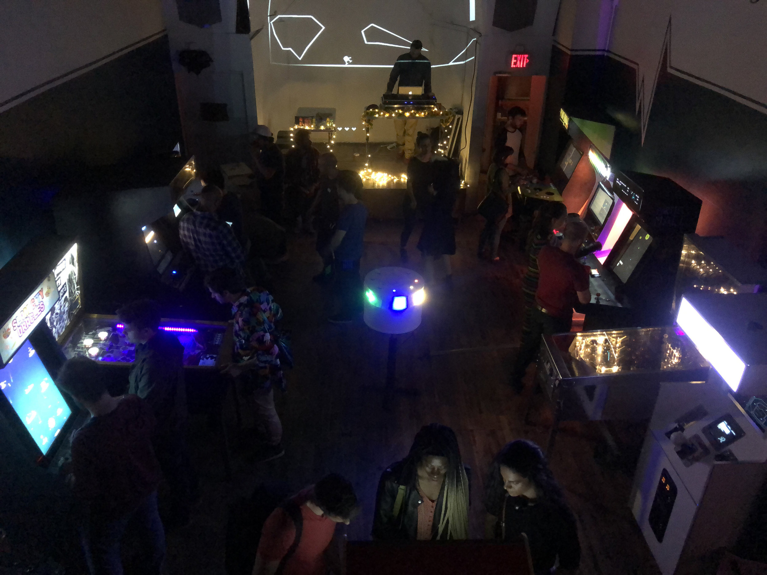 Retro arcade game at Wonderville corporate mixer, experiential marketing event lounge.