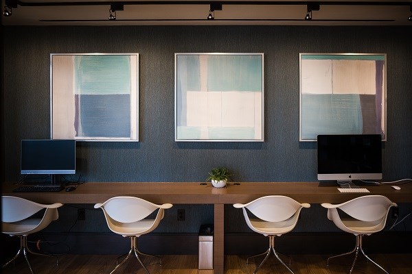 Minimalist Alexander clubroom business center for event breakout sessions and co-working.