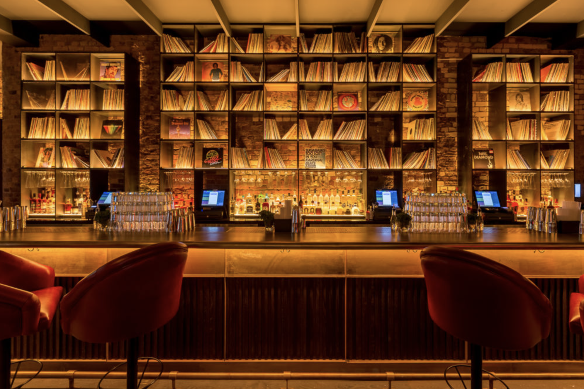 Stylish bar area with vinyl records, perfect for gatherings and networking events.