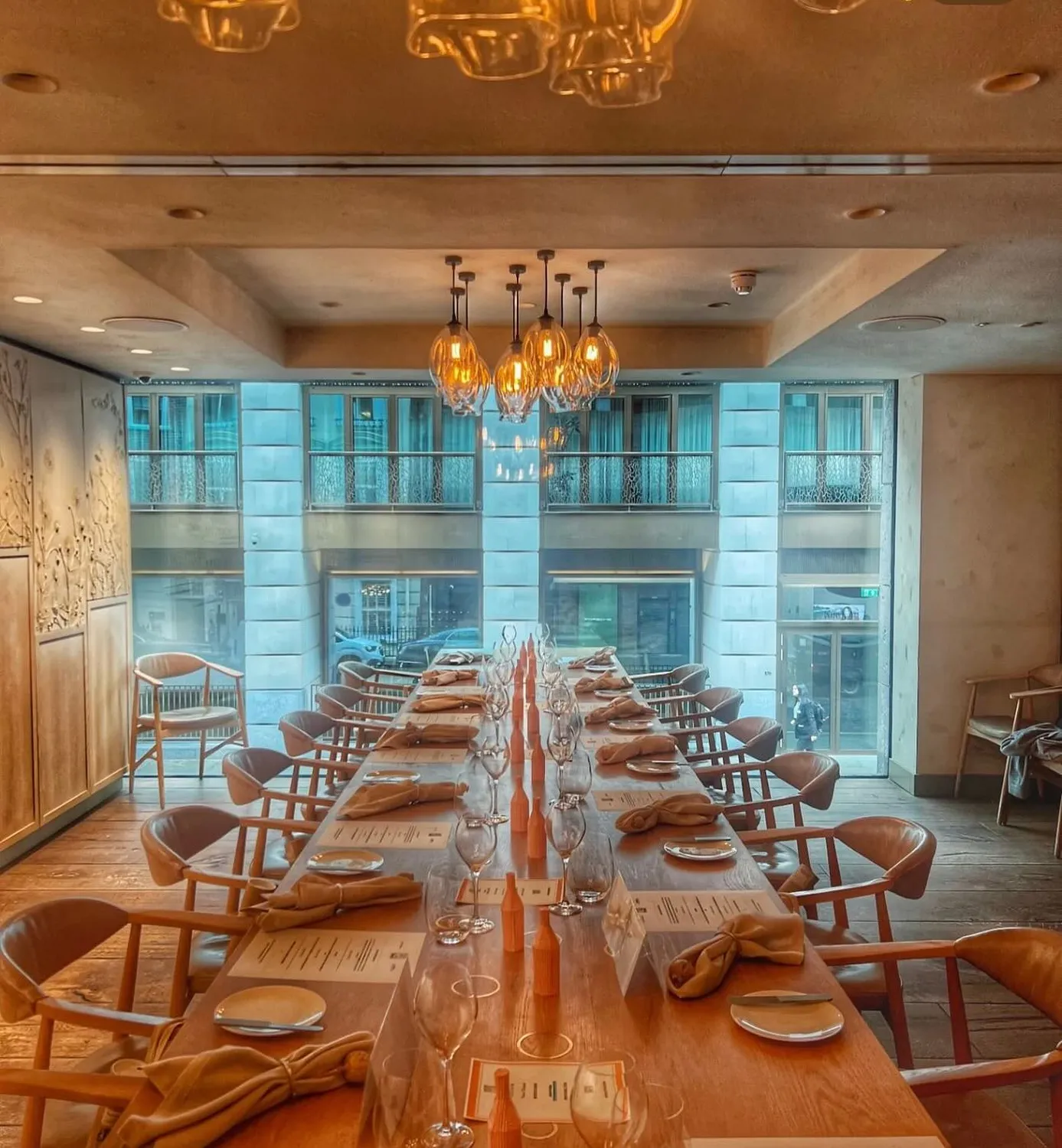 Private dining room with long table for corporate events at Hide Restaurant.