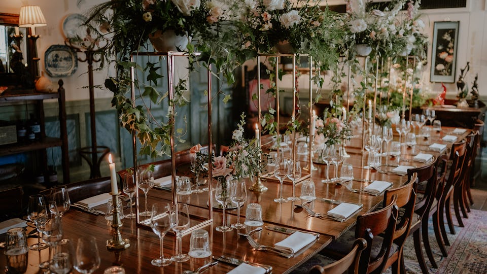 Elegant banquet table with floral centerpieces for upscale events and dinner parties.