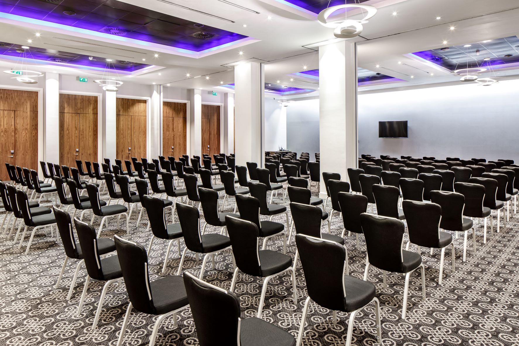 Azzurro Ballroom at Radisson Blu Cardiff, sleek conference space with modern lighting.
