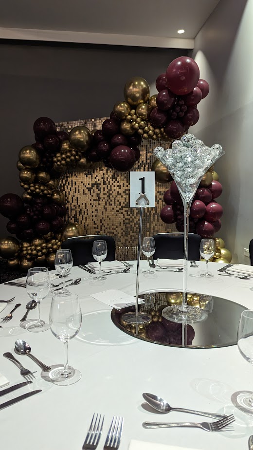 Elegant Azzurro Ballroom table setting with crystal centerpiece for upscale events.