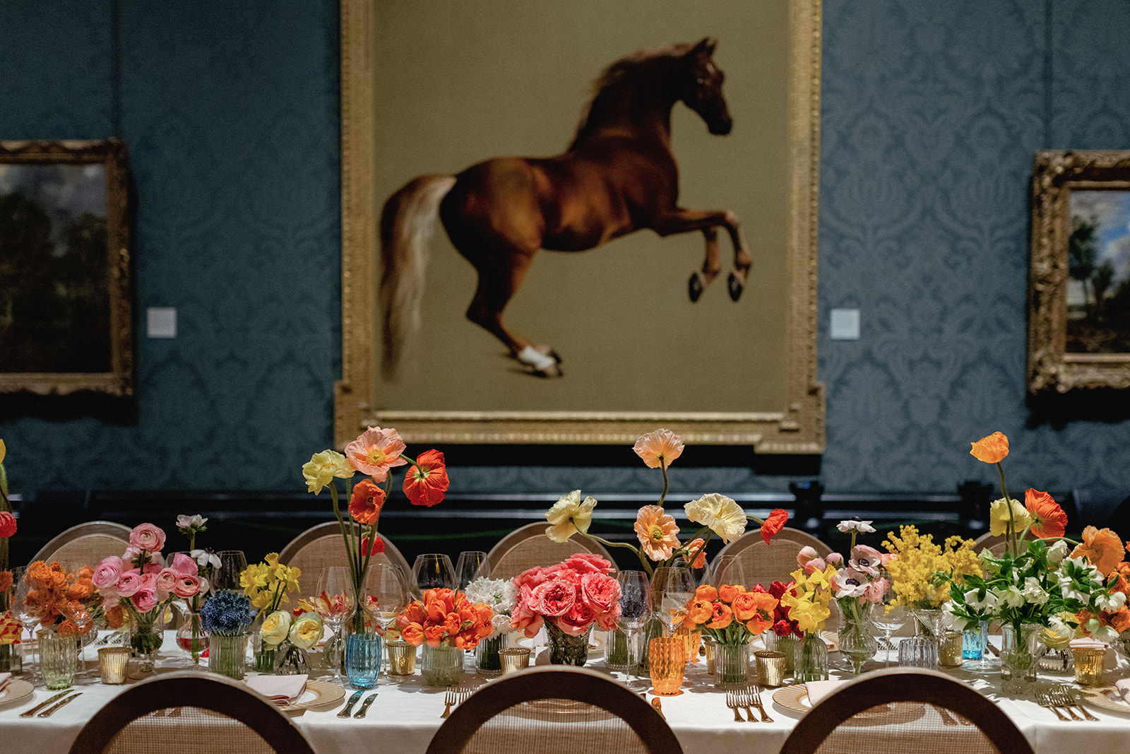 Elegant dining setup with floral decor in The National Gallery, perfect for upscale events.