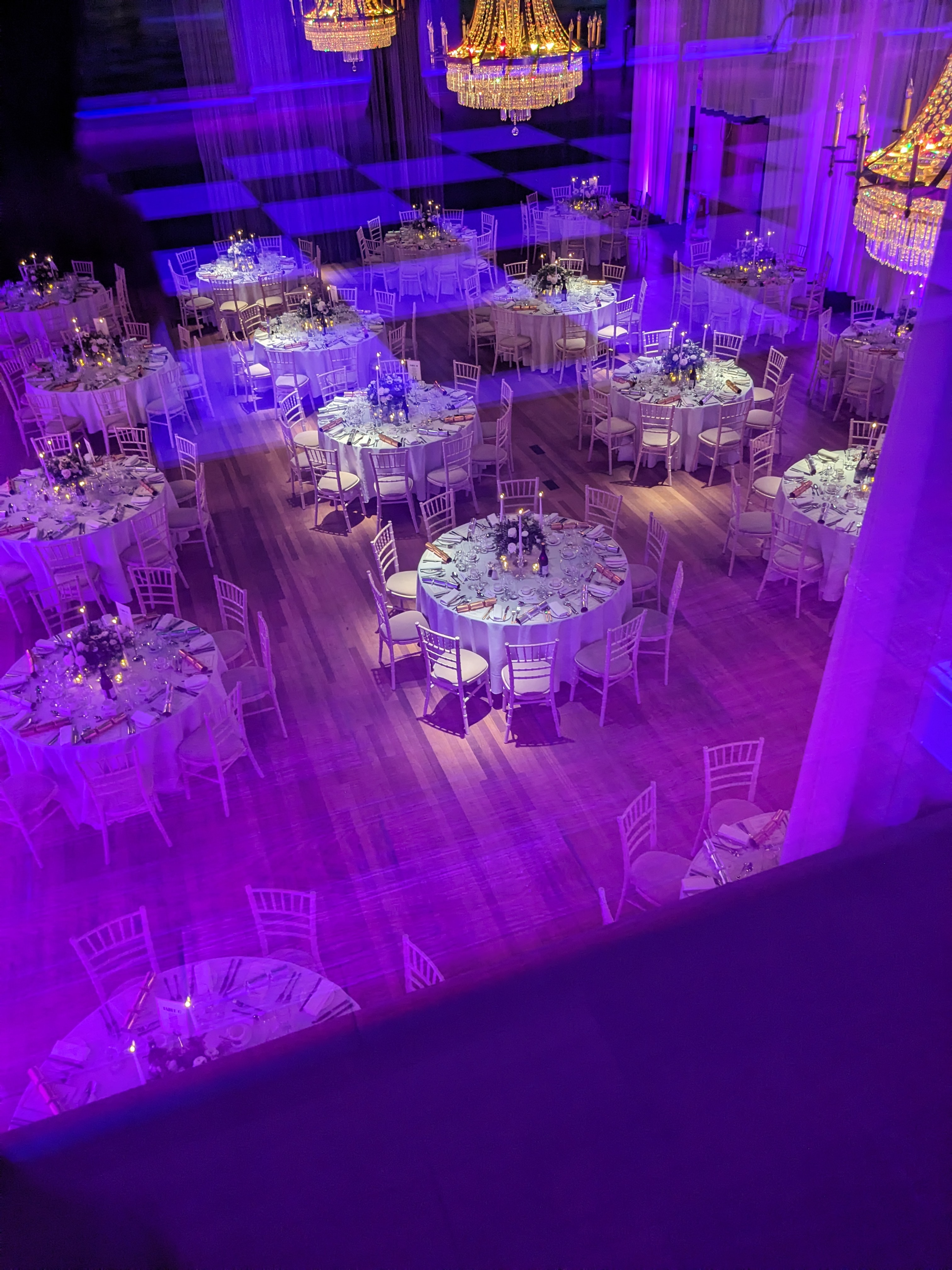 "Elegant Banqueting Hall with floral centerpieces, perfect for weddings and corporate events."