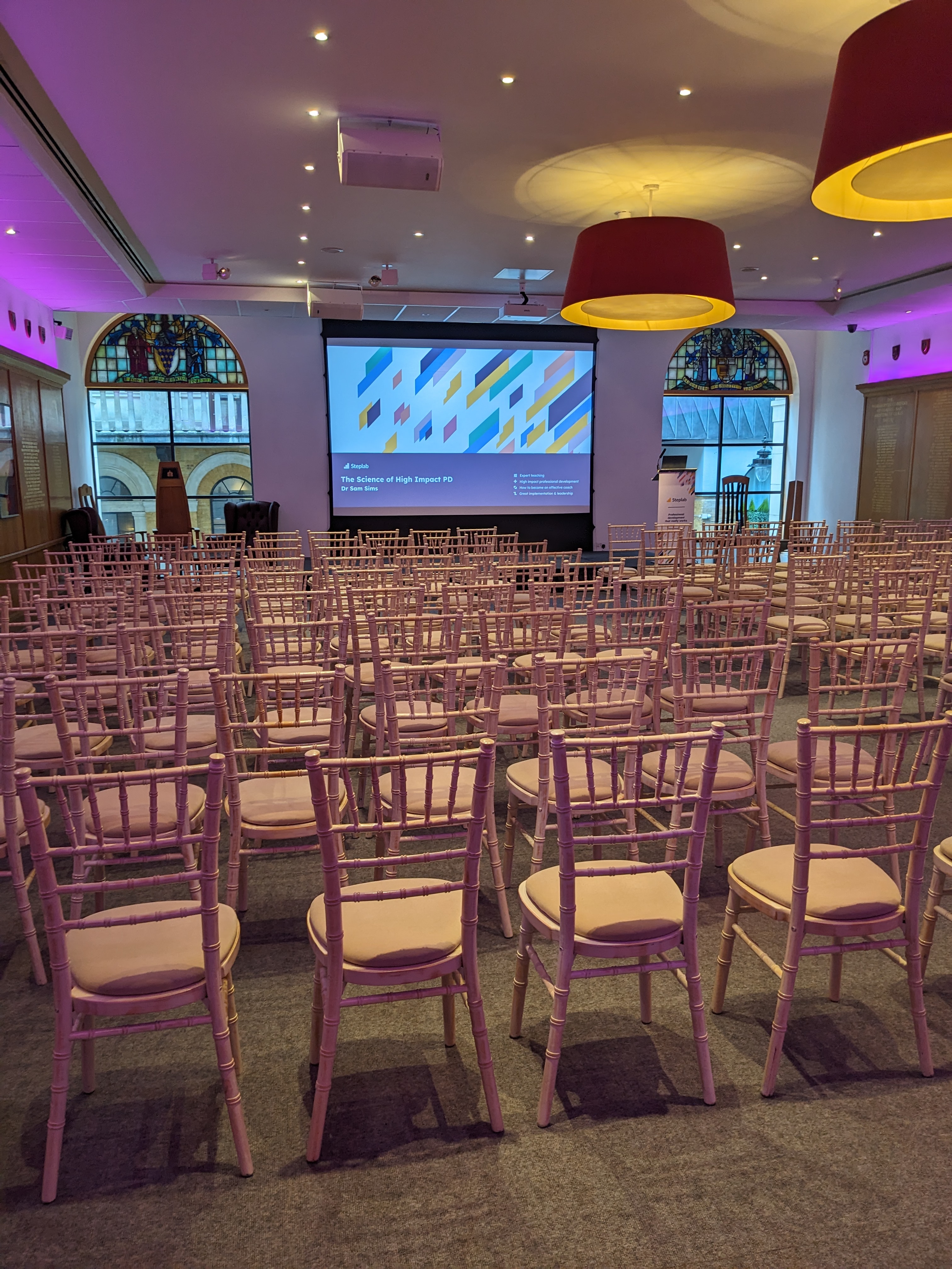 Elegant chiavari chairs in Glaziers Hall, perfect for innovative conferences and presentations.