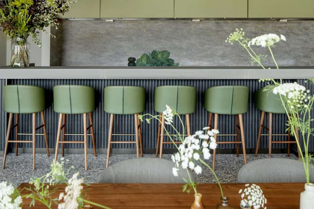 Modern event space in Woods Quay with sleek green stools, perfect for cocktail receptions.