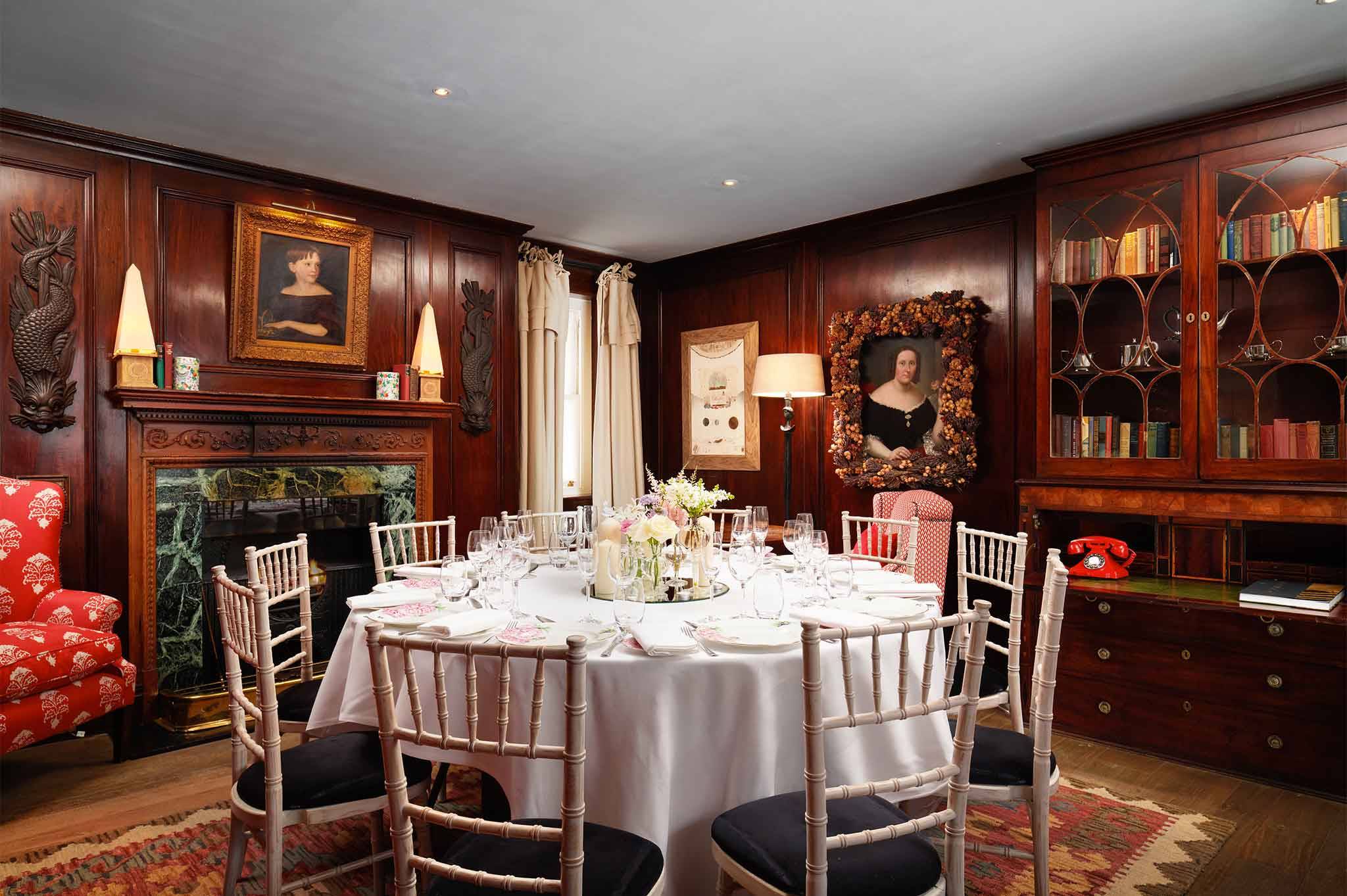 Intimate restaurant dining space with elegant table setting for exclusive events.