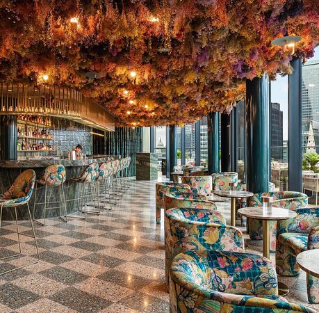 Restaurant in The Pelham with floral ceiling, ideal for upscale events and gatherings.