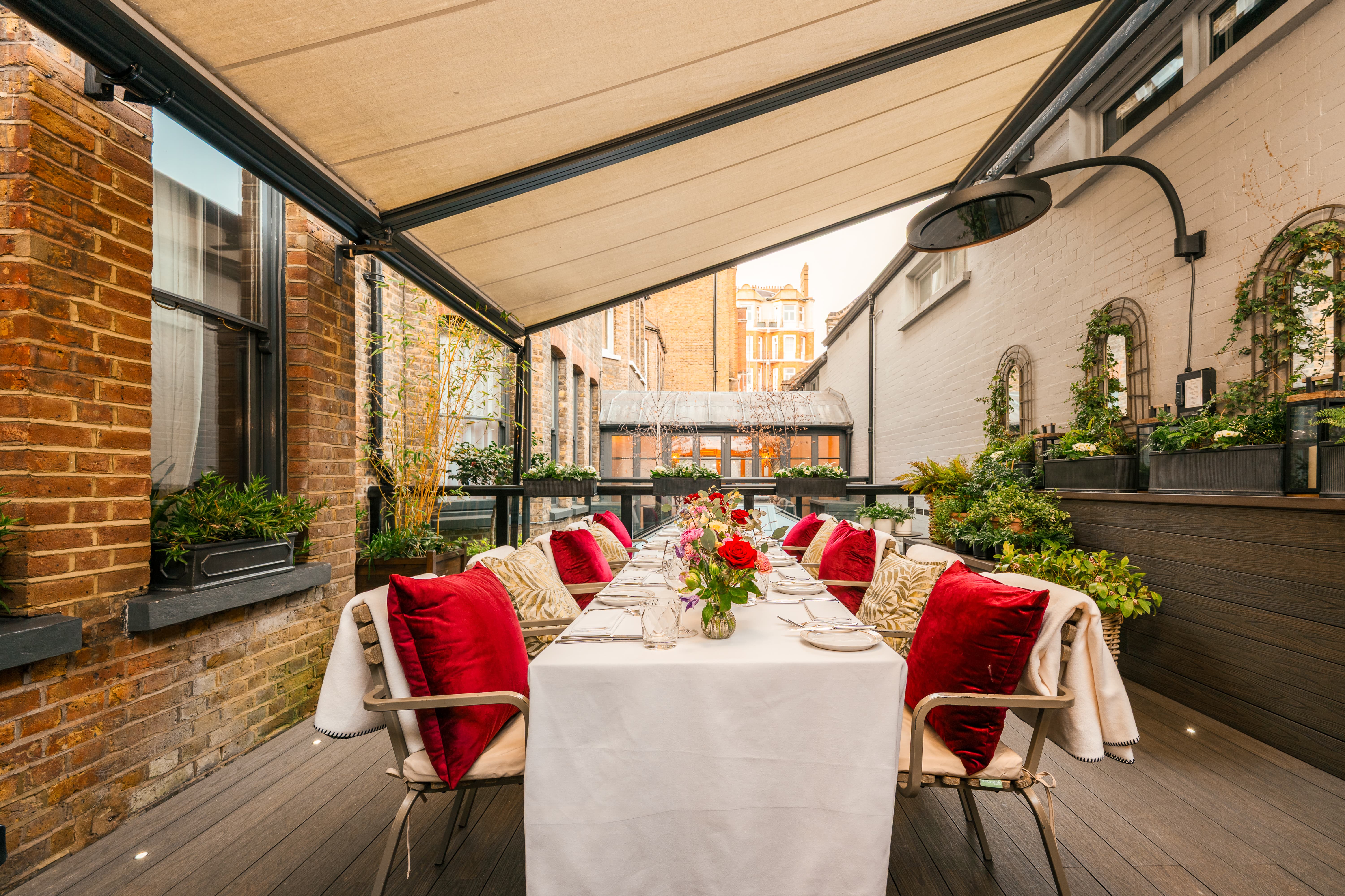 Private dining at The Secret Garden: Red velvet decor for VIP events and networking.