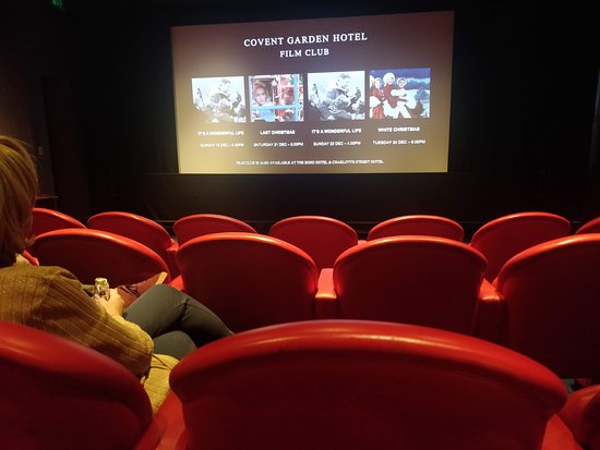 Cozy screening room at Covent Garden Hotel, ideal for film club events and gatherings.