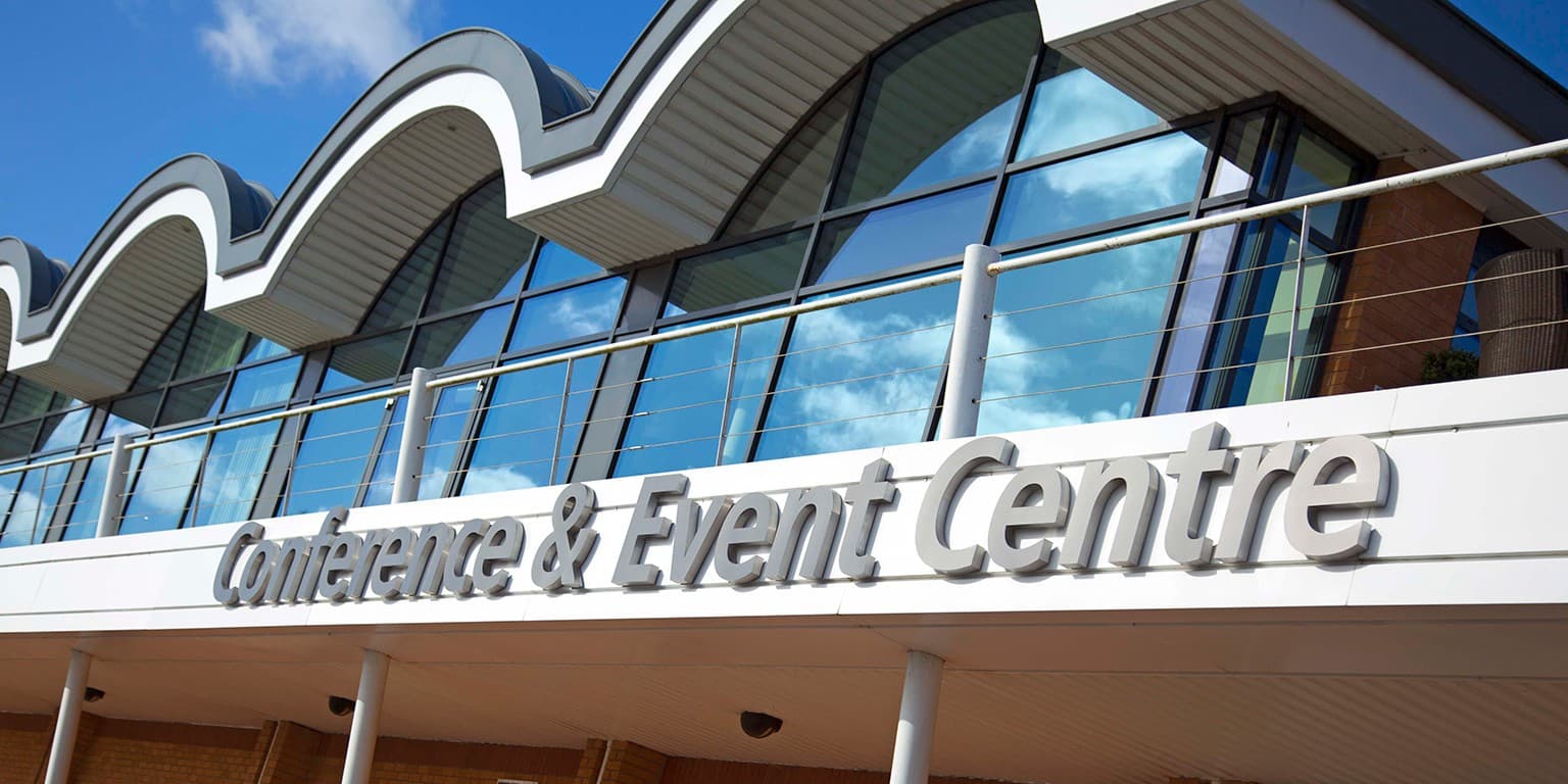 Modern Cranmore Park facade: professional venue for corporate meetings and trade shows.