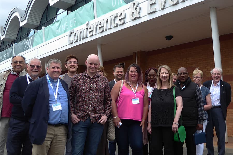 Group photo at Cranmore Park networking event with attendees wearing name badges.
