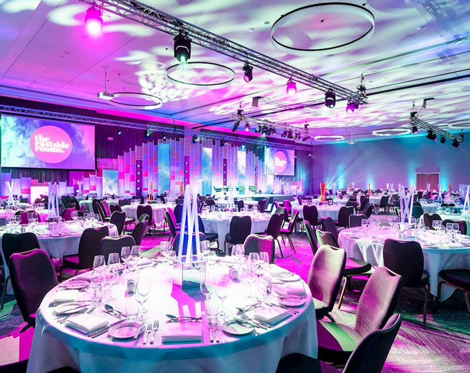 Aloft Birmingham Eastside gala meeting room with immersive dynamic lighting and projection screens.